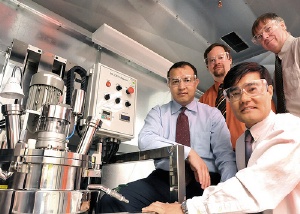 Argonne National Laboratory battery researchers (from left) Khalil Amine, Chris Johnson, Sun-Ho Kang and Mike Thackeray flank a continuously stirred tank reactor used to produce scaled-up quantities of cathode materials for lithium-ion batteries. Argonne
