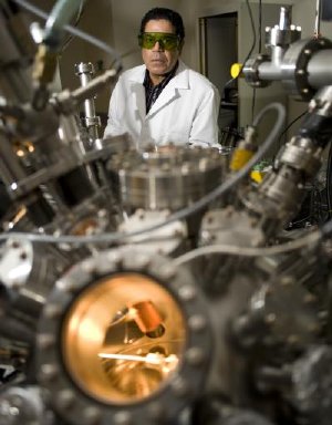 Nuclear engineer Ahmed Hassanein works at his Purdue lab, where researchers are adapting the same methods used in fusion-energy research to develop a new type of "nanolithography" for creating future computer chips. Supercomputers at the US Department of Energy