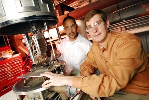 Researchers Jud Ready and Mitchell Walker prepare a carbon nanotube field emitter sample for measurements in the High-Power Electric Propulsion Laboratory of Georgia Tech’s School of Aerospace Engineering. (Georgia Tech Photo: Gary Meek)