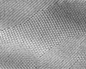 This electron micrograph shows a self-assembled composite in which nanoparticles of lead sulfide have arranged themselves in a hexagonal grid. Credit: Ting Xu, Lawrence Berkeley National Laboratory- UC Berkeley