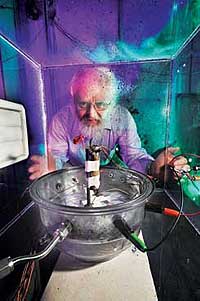 Sandia researcher Peter Roth prepares to blow up a battery to see how robust it is. The work is part of the DOE-funded FredomCAR program. (Photo by Randy Montoya)