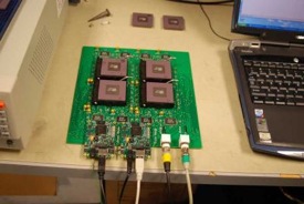 Compression chips mounted on a board at University of Idaho are ready for radiation testing.
