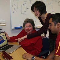 Professor Alice Parker, left, discusses the animation of a synaptic connector with graduate students Chih-Chieh Hsu, center, and Jonathan Joshi. Photo/Diane Ainsworth