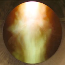 A cloud of alumina nanoparticles, cooling down at a rate of 1 million degrees Celsius per second, exits the PNF