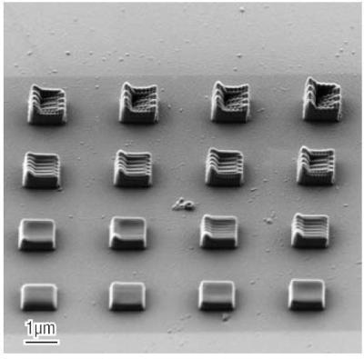 A 4 by 4 array of rectangles used for electron beam assisted deposition. The dwell point spacing was varied by row and by column.