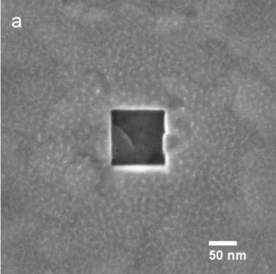 Square vias being created in 100 nm thick Au. Size in a) is 100 nm, size in b) is 50 nm.