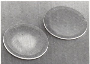 SEM image of a 316 stainless steel TEM specimen disc after grinding (left) and polishing (right) with CBN.
