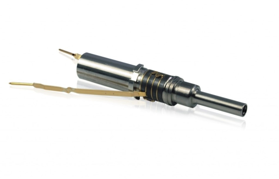 Instrument for ultrasonic plaque removal (OEM product). The dark rings are piezo disks with copper electrodes in between. (Image: Sirona)