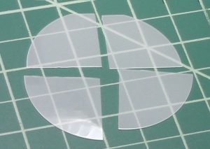 Bare sapphire wafer after cleaving into quarters using the FlipScribe and Cleanbreak pliers.