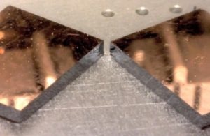 Copper film on (100) silicon cleaved after making a short scribe