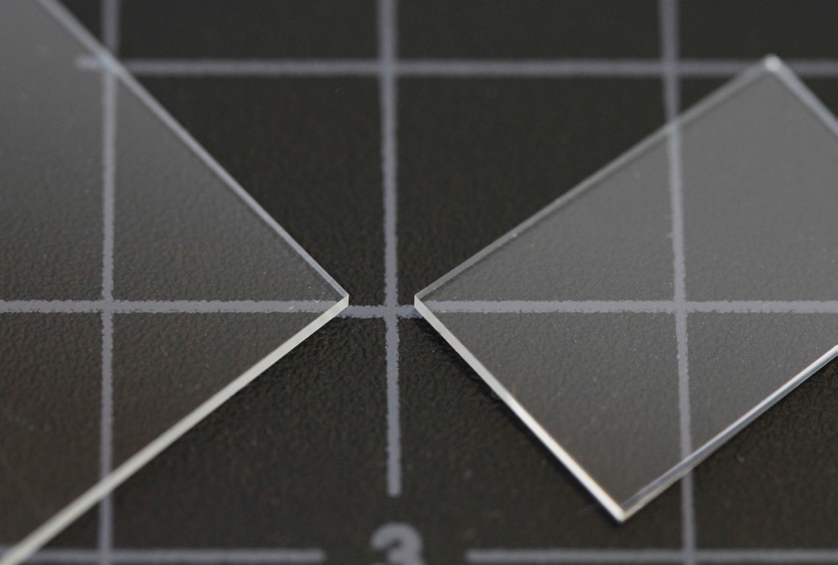 Glass slides cleaved using the LatticeAx. The scribeless cleave process of the LatticeAx eliminates generation of dust particles, making it ideal for downsizing the glass slide that already contained unique, proprietary fibers.