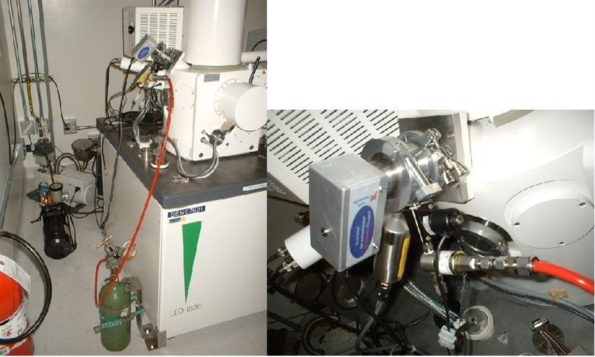 Oxygen tank attached to Evactron Decontaminator low energy plasma cleaner. Red tubing connects the bottle/regulator to the intake port of the Evactron.