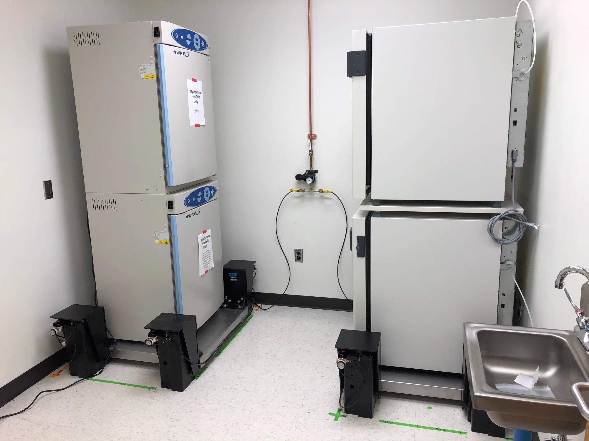 Incubators stacked on TMC MaxDamp vibration isolation platforms.