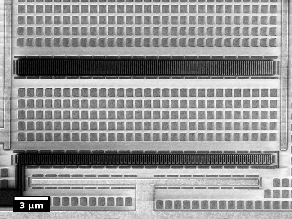Closed circuit biasing of contact chain structures using two tips (Tips not show in the image). The voltage drop along the chain structures becomes visible as a gradual decrease of voltage contrast.