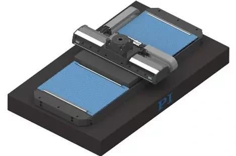 A 3-axis wide base rails on granite XY-theta stage with bellows for protection on the lower linear axis and seal strips on the upper linear axis