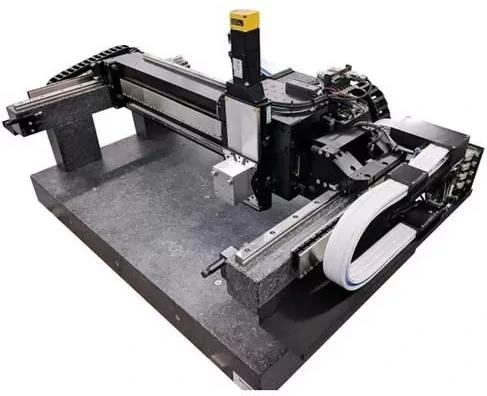 A 3-axis hybrid gantry stage with mechanical linear bearing rails and linear motor tracks mounted on granite and an air bearing on the cross axis. The Z-axis uses a ball-screw-driven stage with 3-phase rotary motor, absolute encoder, and a brake.