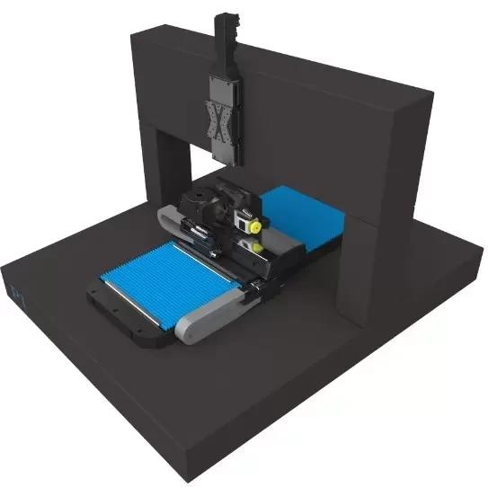 A 5-axis split-bridge rails-on-granite motion system with bellows to protect the wide-base lower linear axis from debris
