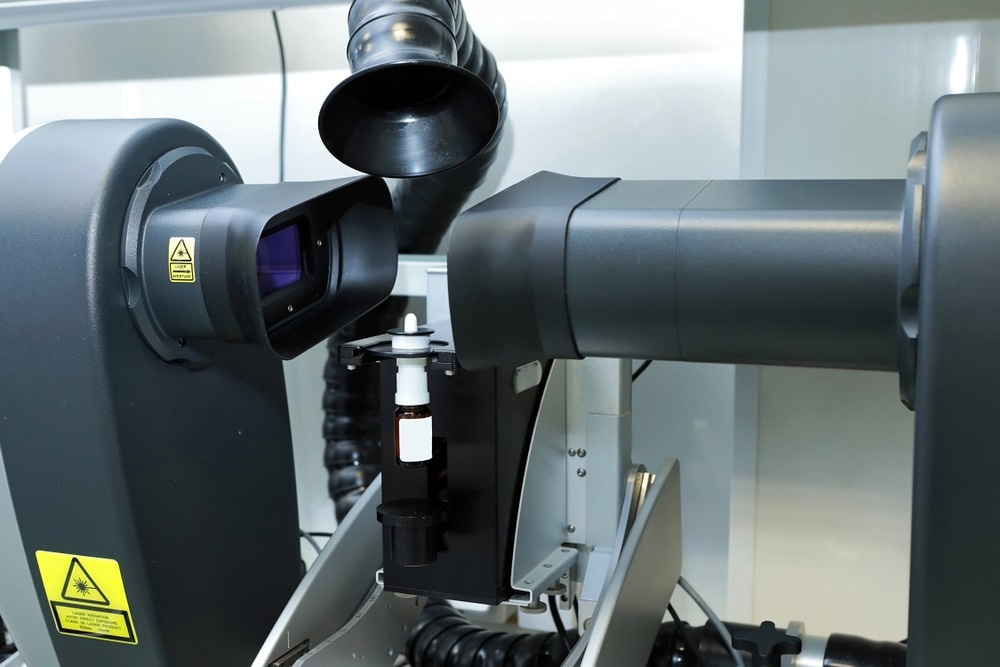 The worker measures the size of the particles and drops of the spray. Pharmaceutical industry and laboratory. Measurement of particle size with a laser. Malvern spraytec. Production of pharmaceutical