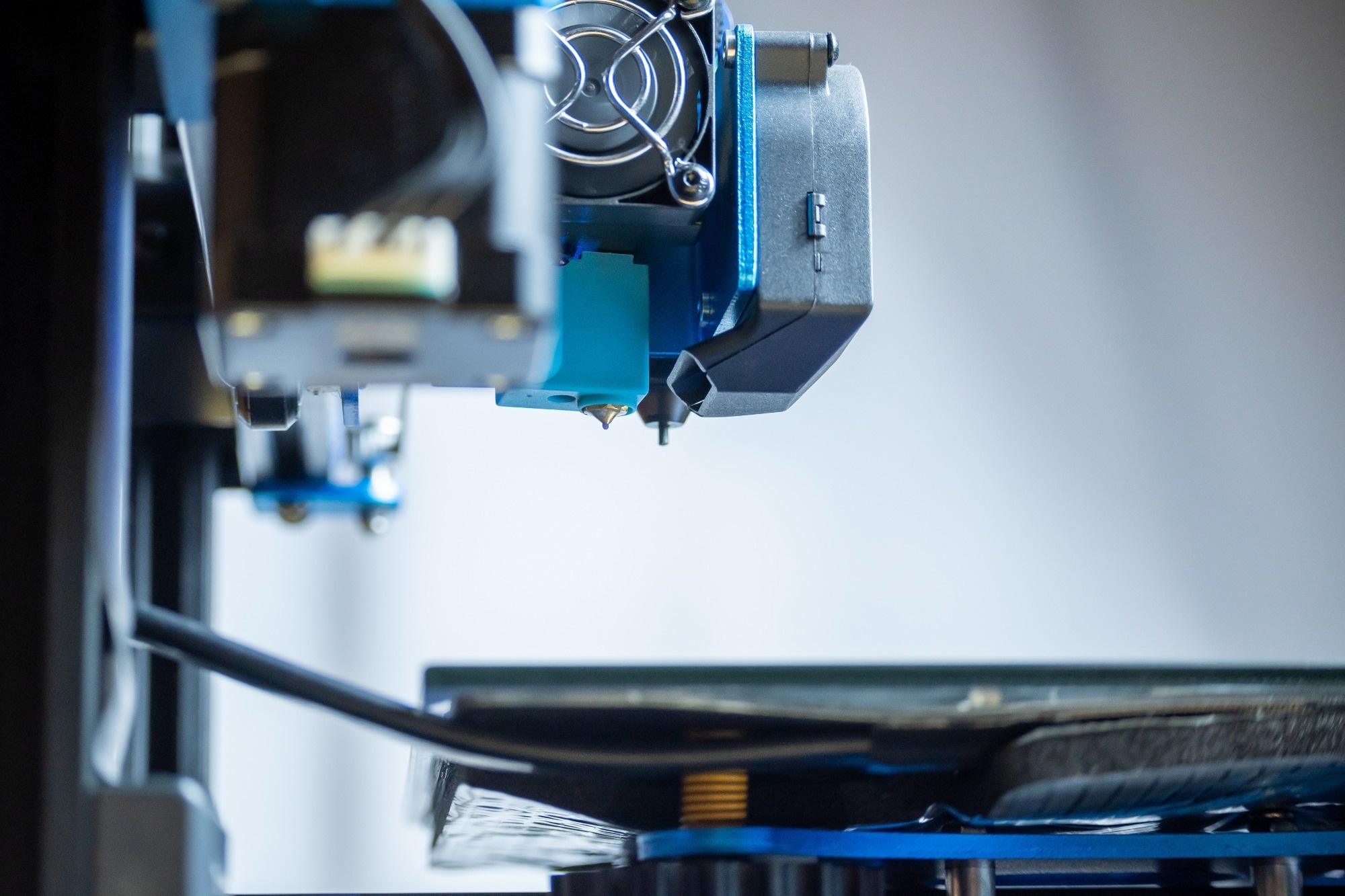 Close-up detail of the extruder of a 3D printer