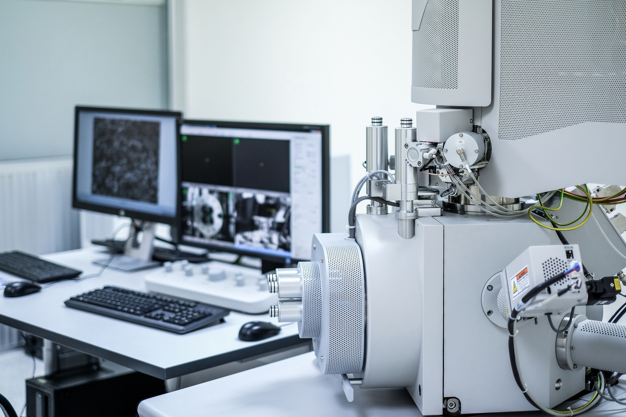 Scanning Electron Microscope (SEM) machine and blur computer controller background in laboratory