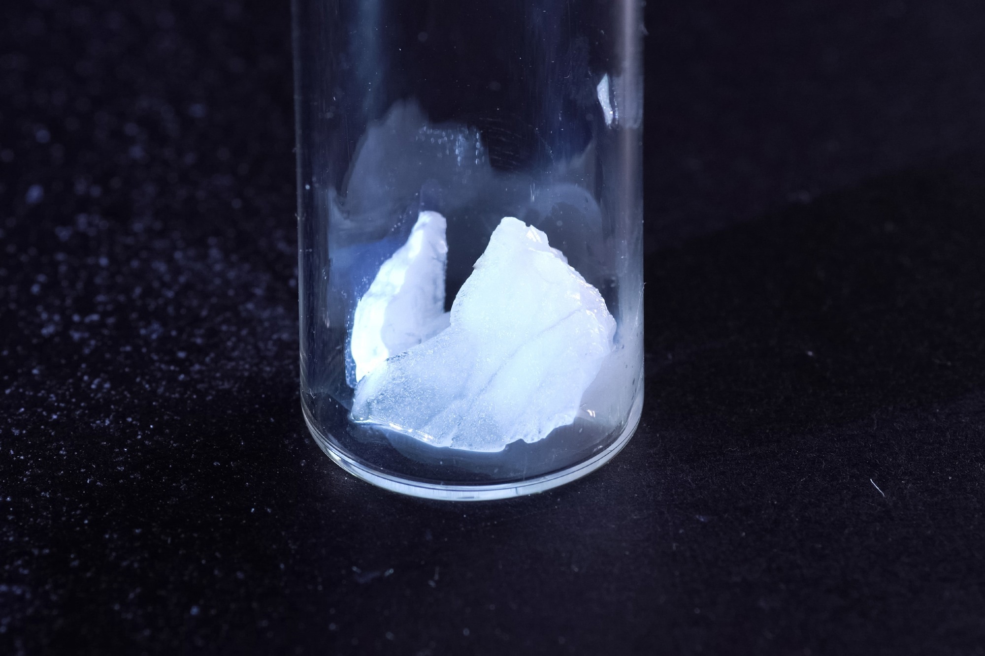 Close-up image of a test tube containing crystalline gel material