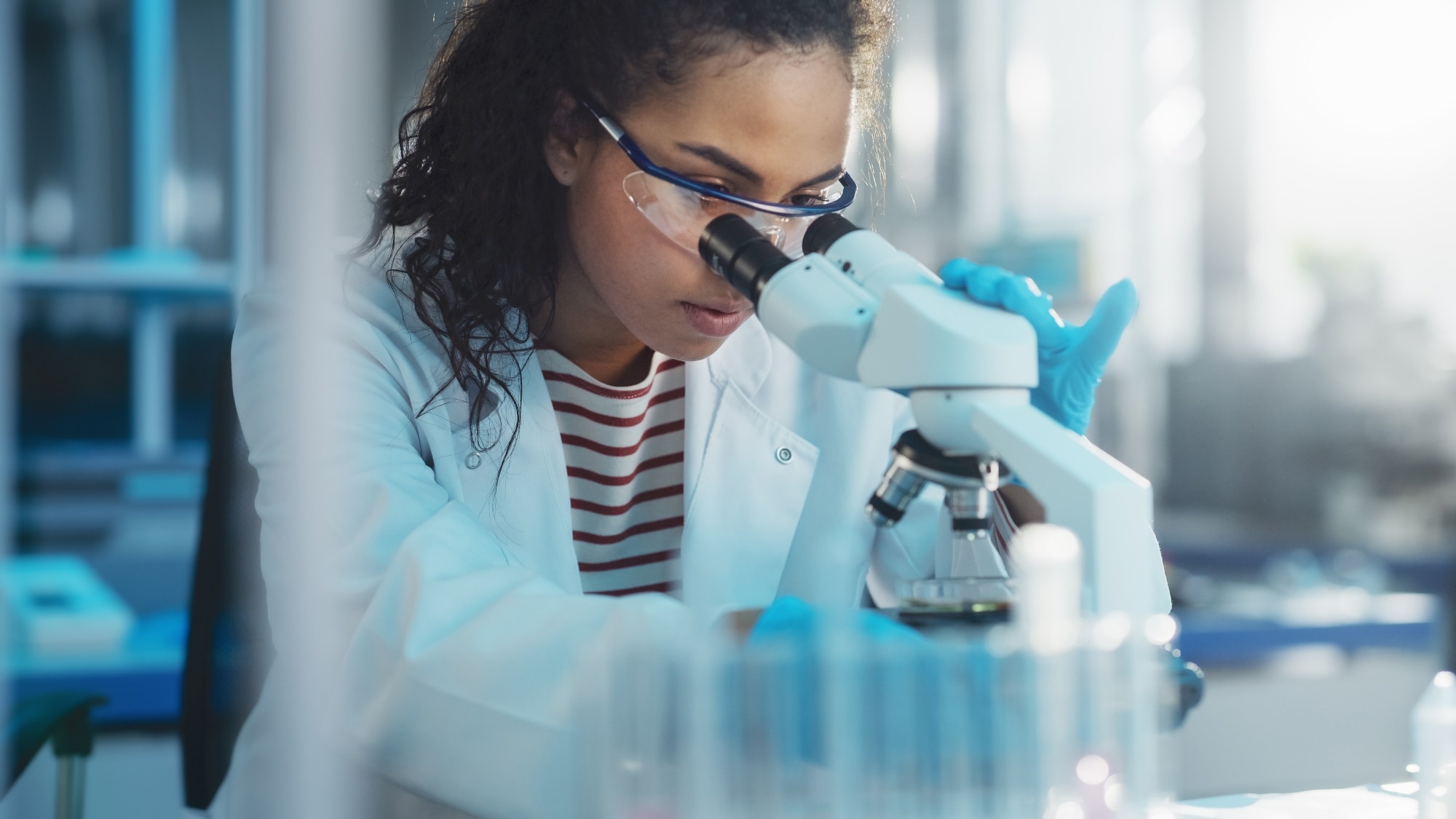Scientist Looking Under Microscope