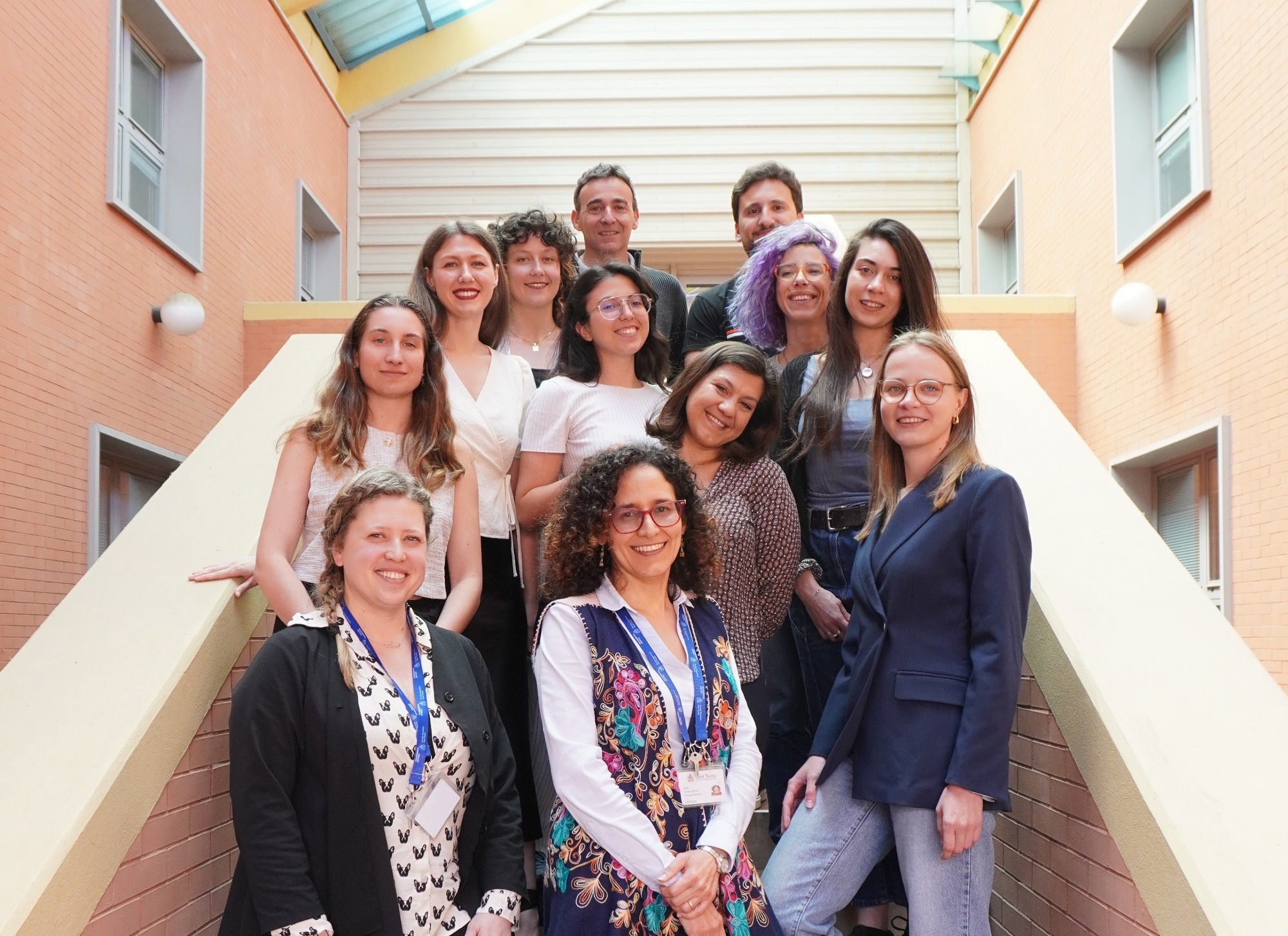 The Greco research group standing on steps.