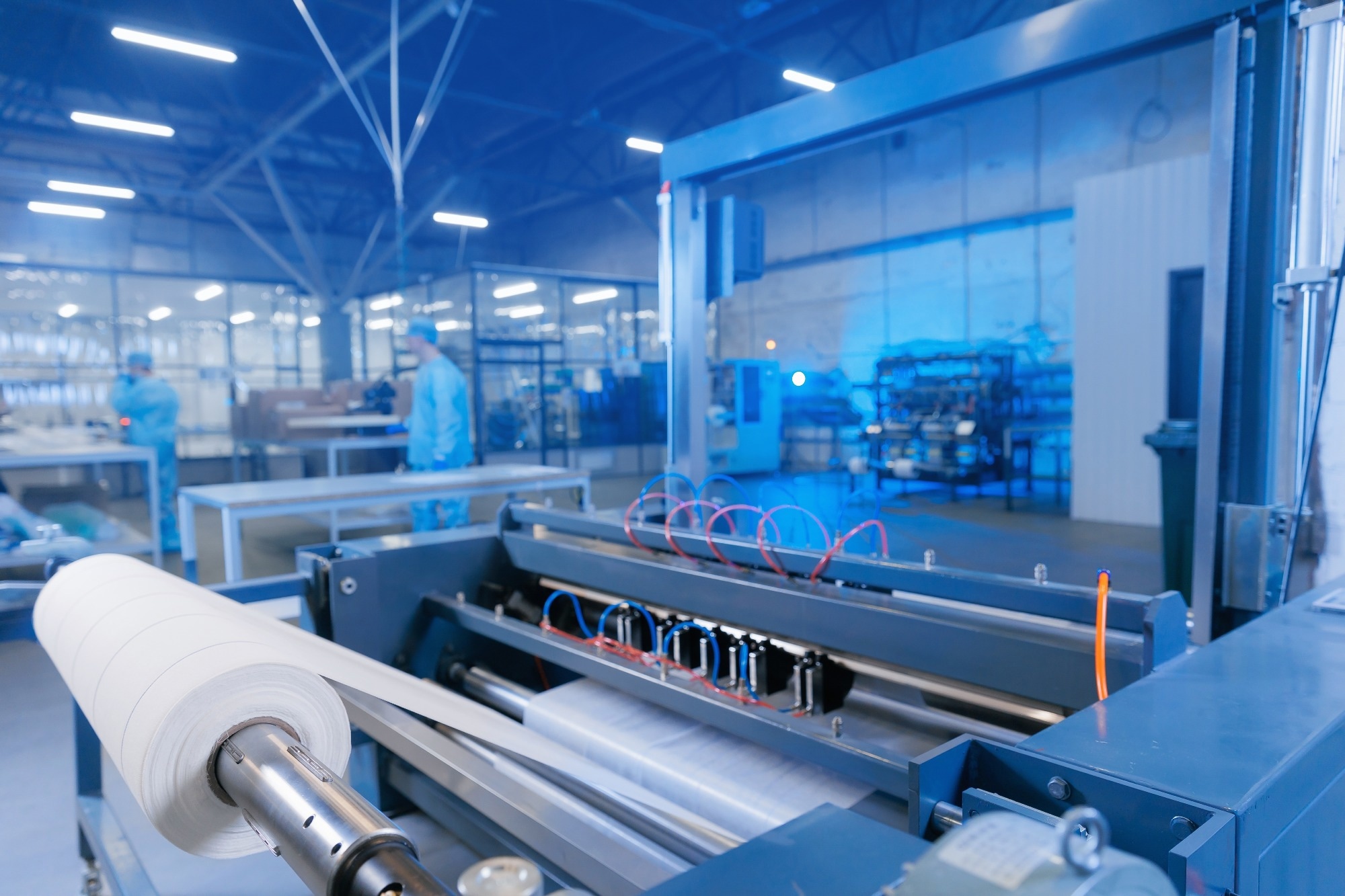 Thin film material production factory. Material on a conveyor belt.