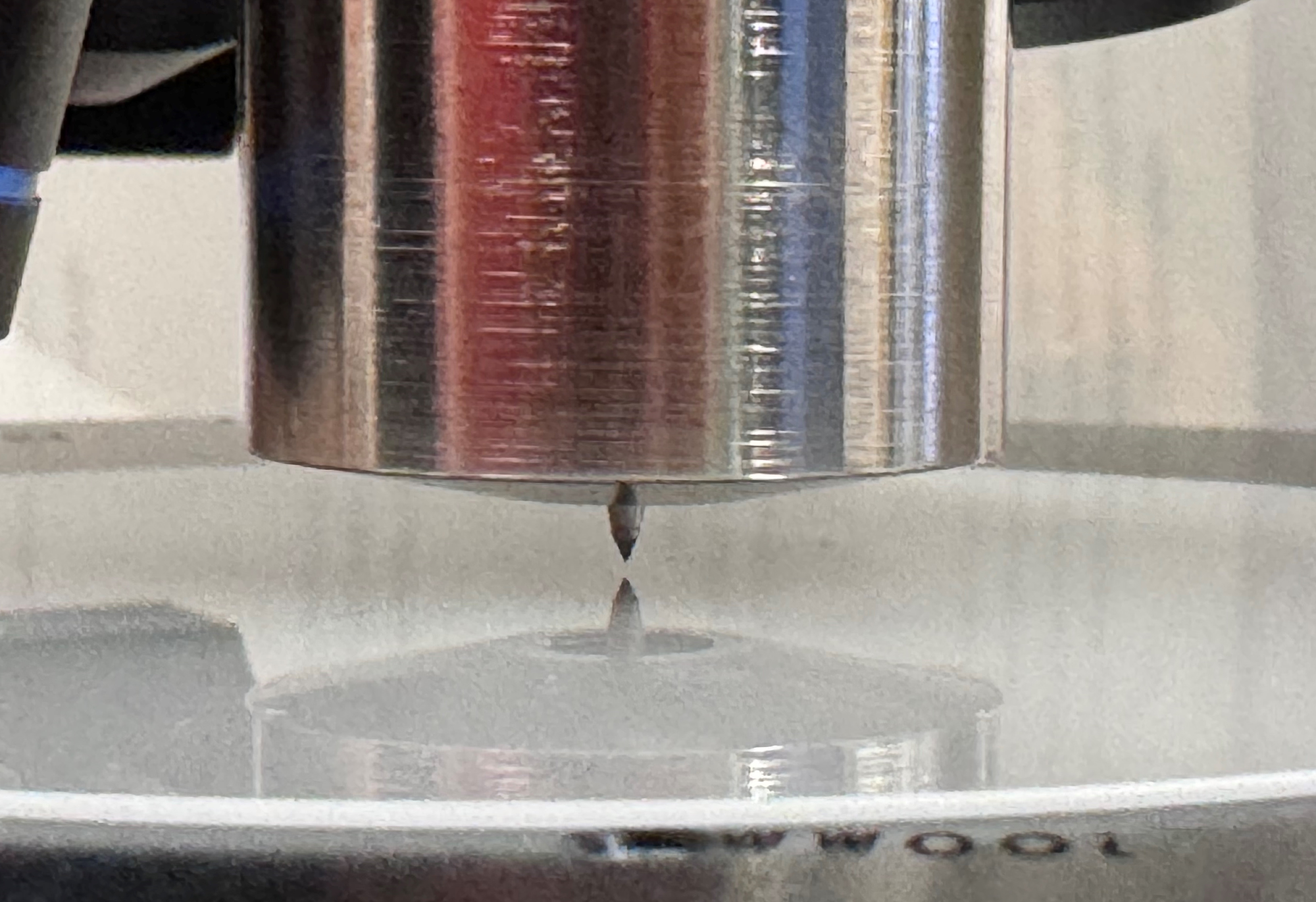 Diamond scribe mounted into the Zeta<sup>™</sup>-20 optical profiler objective turret. The scribe is centered in the holder, pointing down toward the wafer below