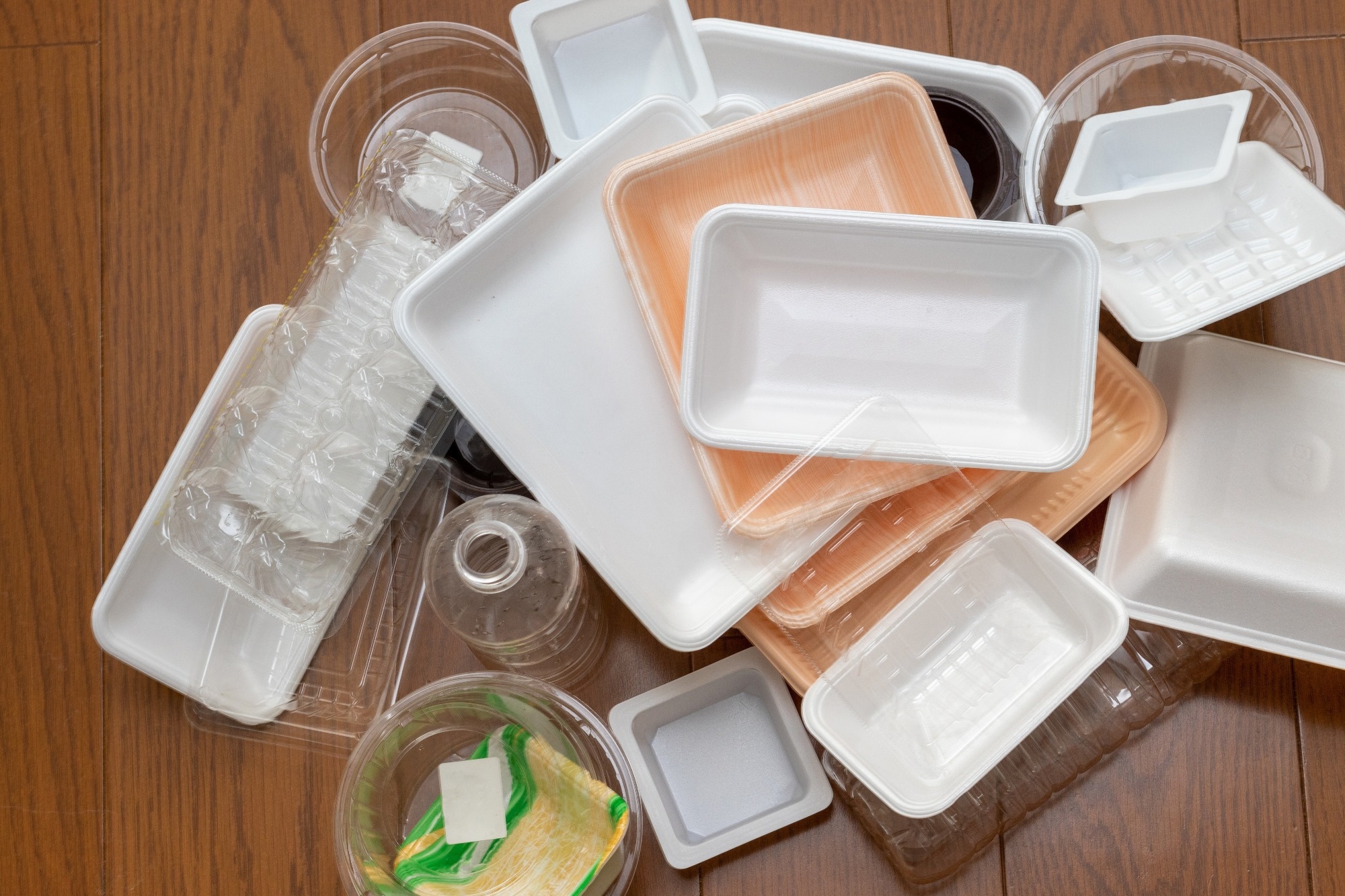 plastic waste on wooden floor