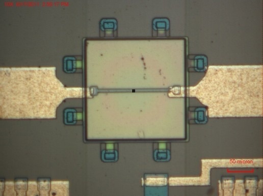 Integrated circuit imaged through a CRAIC Technologies microspectrophotometer; the black square denotes the entrance aperture defining the sampled area