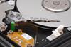 Measuring Substrate-Independent Young’s Modulus of Hard Overcoats for Magnetic Media Using a Nano Indenter