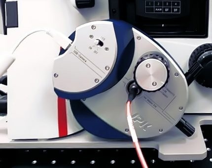 Fiber-coupled detection module mounted on a Leica microscope side port.