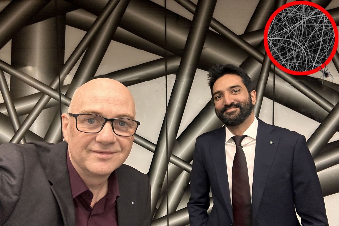 Günther Rupprechter and Qaisar Maqbool with a visualization of the nano web.