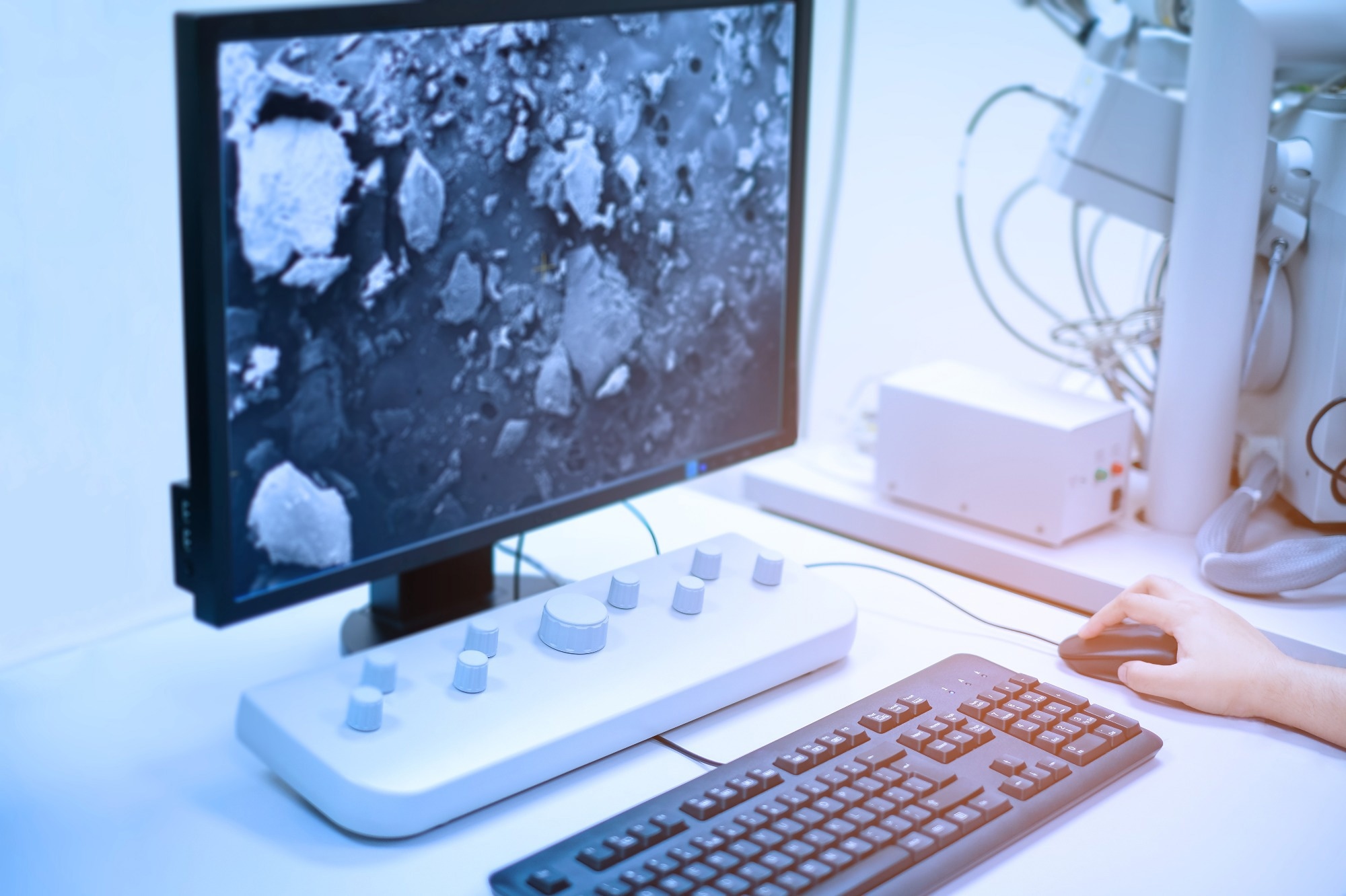 Scientist is analyze nanomaterials with Scanning Electron Microscope (SEM) machine in laboratory