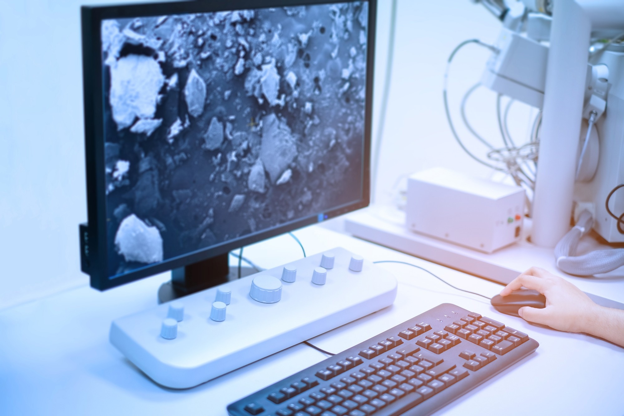 Scientist is analyze nanomaterials with Scanning Electron Microscope (SEM) machine in laboratory