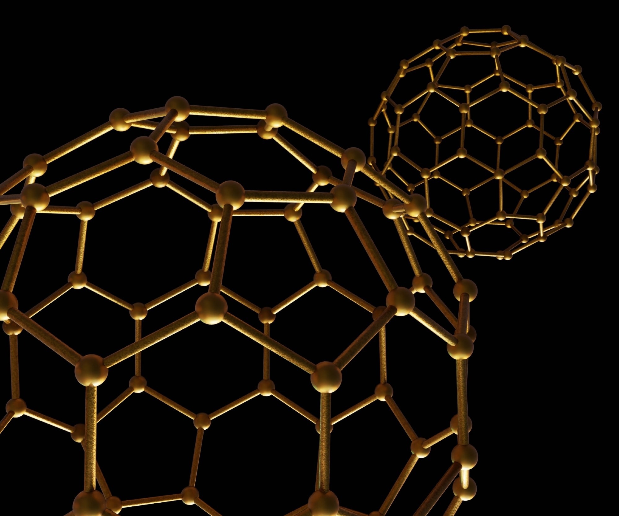 3D illustration of two gold-colored spherical nanoparticle structures, resembling buckyballs or fullerene molecules, connected by atomic bonds against a black background
