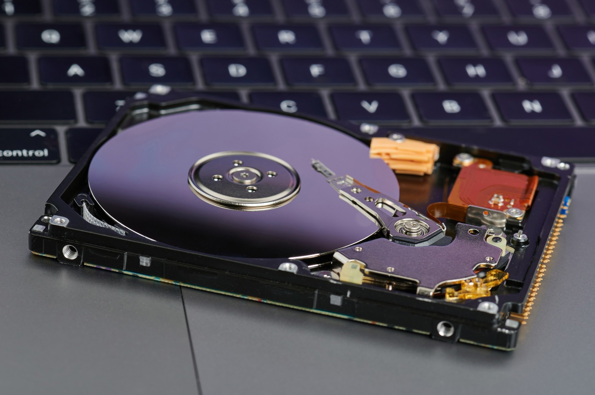 Hard drive on laptop keyboard background