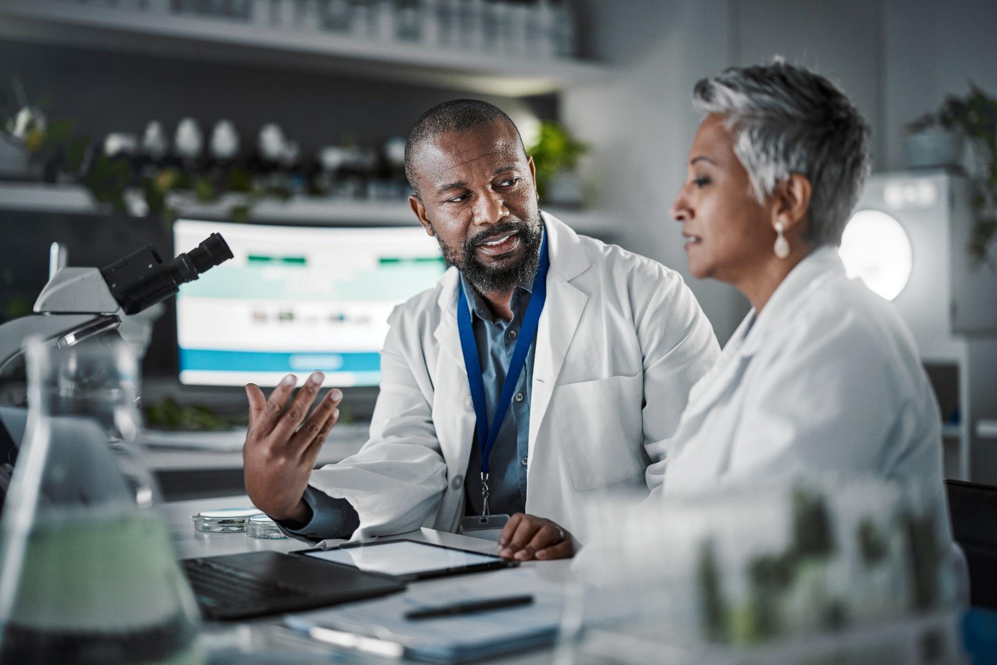 To researchers talking in a lab