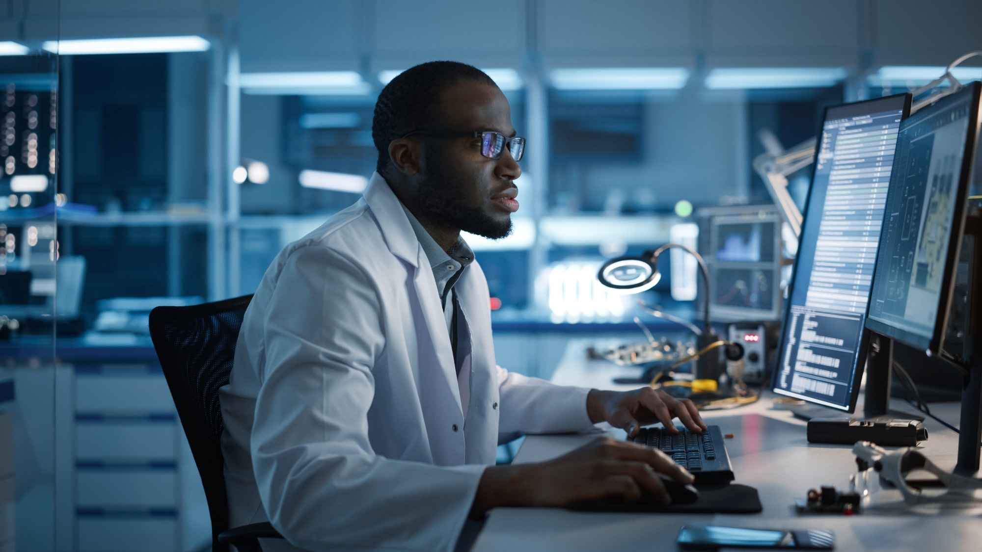 Male Engineer Works on Computer