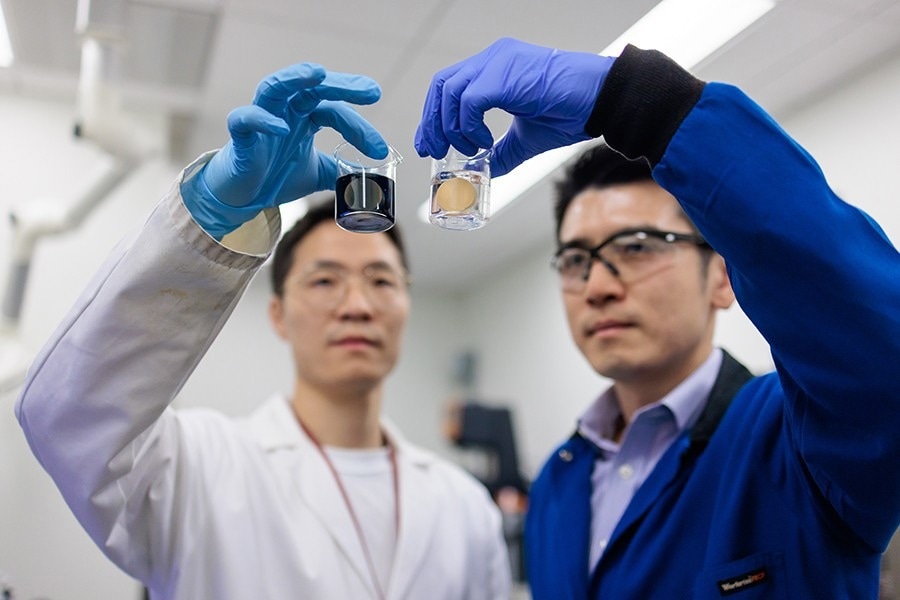 New research from the lab of Asst. Prof. Po-Chun Hsu at the University of Chicago Pritzker School of Molecular Engineering, in collaboration with Duke University. Image Credit: John Zich/University of Chicago The researchers hold up the nanoparticles and a kidney stone.