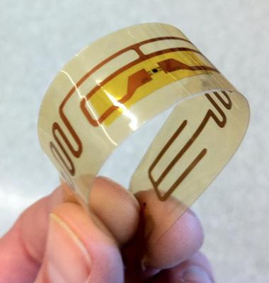 Novel Laser Technology for Ultrathin Chip Assembly onto Flexible Substrates