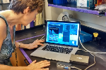 DNA Molecules Dragged Through Nanopores for Handheld Sequencing Device