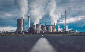 Emission of Fe- and Ti-Containing Nanoparticles from Coal-Fired Power Plants