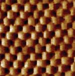 Atomic lattice of HOPG obtained at extremely low scan rate (about 1 line/sec)