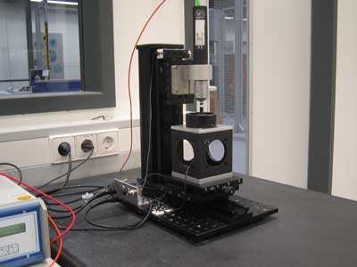 View of the out-of-plane actuation measurement set-up placed on the stone table with pneumatic shock absorber system.